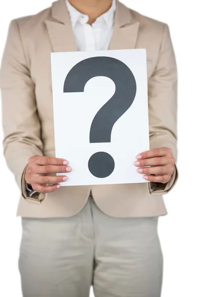 Businesswoman holding a question mark sign — Stockfoto