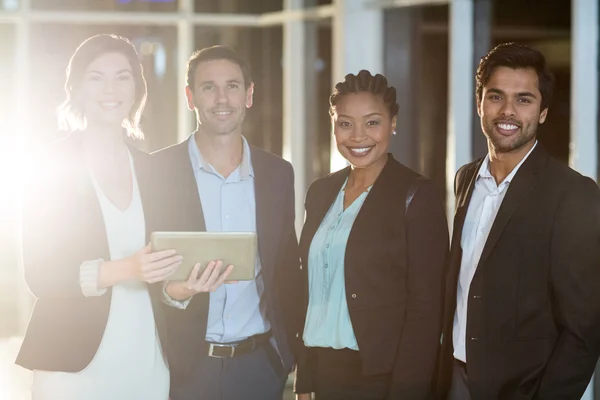 Group of businesspeople standing in office — Stock Photo, Image