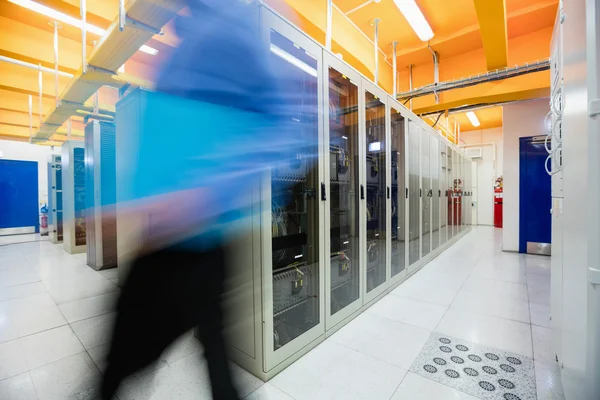 Technician walking in server room — Stock Photo, Image