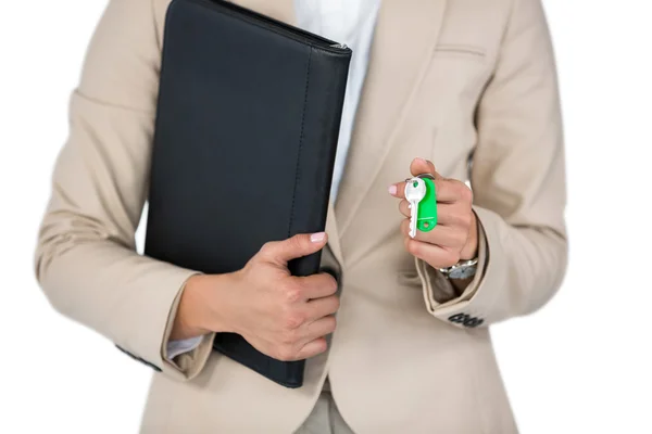 Businesswoman holding a file and key — Φωτογραφία Αρχείου
