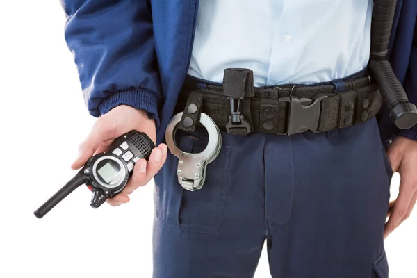 Security officer holding a walkie-talkie — Stock Photo, Image