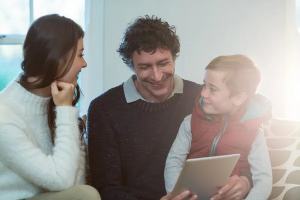Happy family using digital tablet — Stock Photo, Image