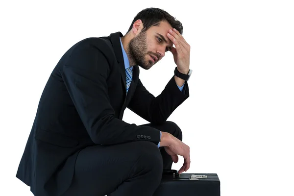 Depressed businessman sitting on steps — Stock Photo, Image