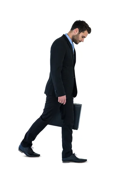 Businessman walking with briefcase — Stock Photo, Image