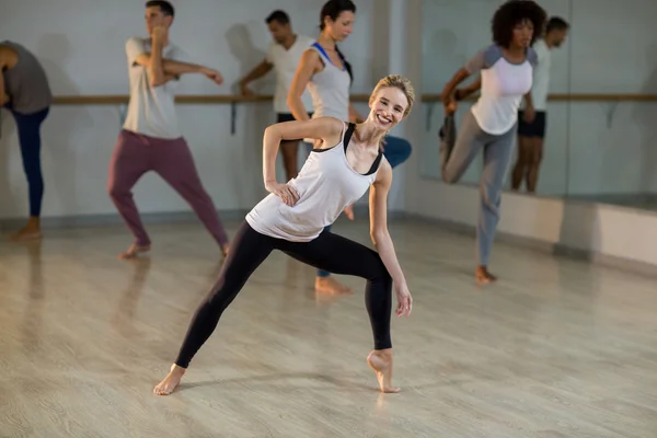 Woman performing stretching exercise — Stock Photo, Image