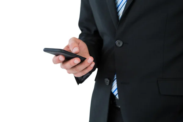 Businessman text messaging on phone — Stock Photo, Image