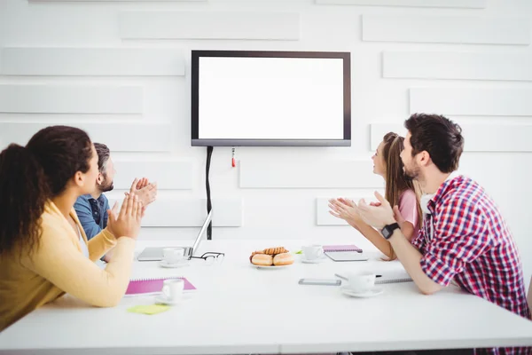 Happy colleagues applauding during meeting — Stock Photo, Image
