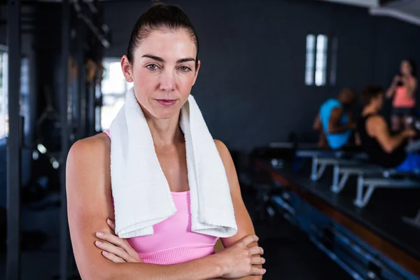 Serious female athlete with arms crossed — Stock Photo, Image