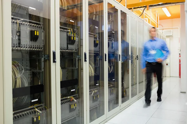 Technician walking in server room — Stock Photo, Image