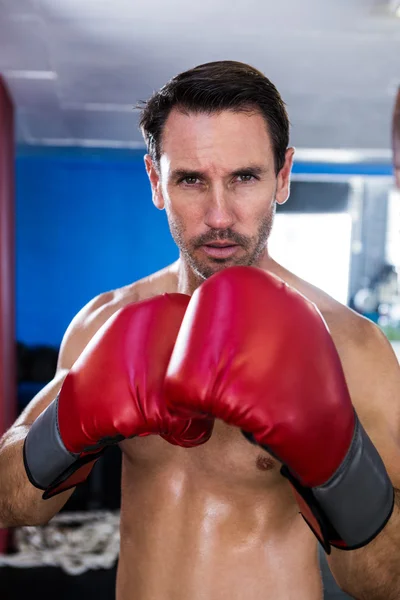 Serious male boxer in gym — Stock Photo, Image