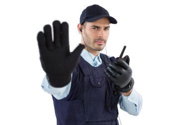 Confident security officer making stop gesture clipart