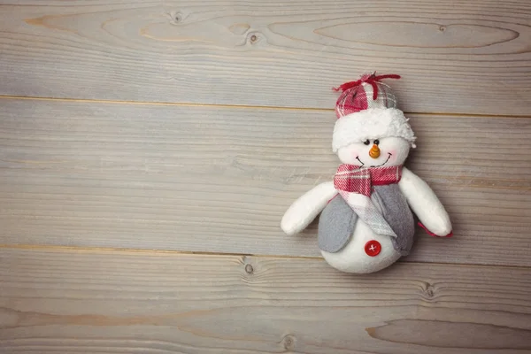 Boneco de neve na mesa de madeira — Fotografia de Stock