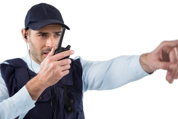 Security officer talking on walkie-talkie — Stock Photo, Image