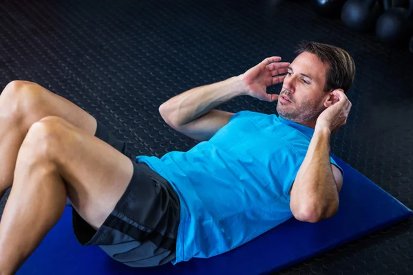 Young male athlete exercising — Stock Photo, Image