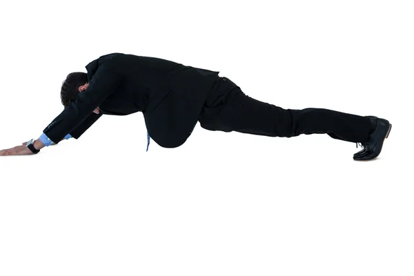 Businessman doing pushup — Stock Photo, Image