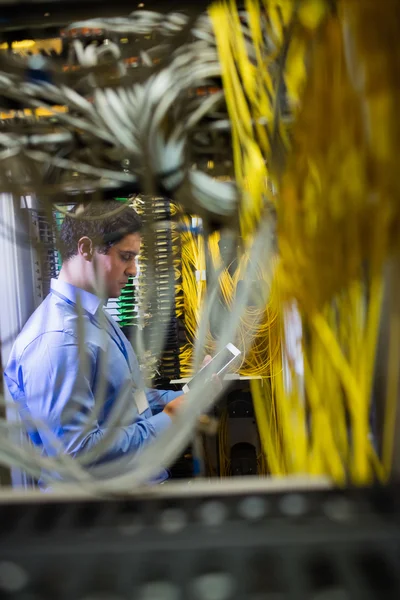 Technician using digital tablet — Stock Photo, Image