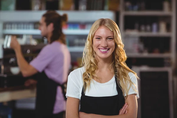 Waitress standing with arms crossed — Stock Photo, Image