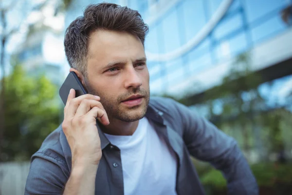 Handsome man talking on phone — Stock Photo, Image
