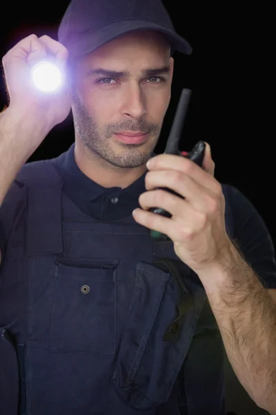 Security officer talking on walkie talkie — Stock Photo, Image