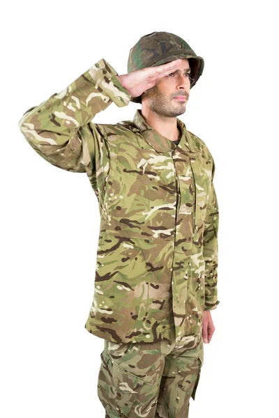 A fehér háttér előtt tisztelegve katona — Stock Fotó
