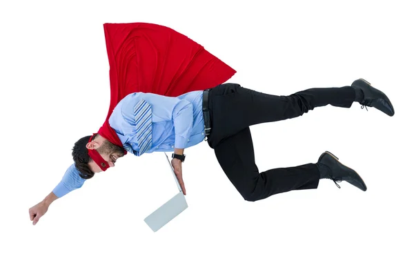 Businessman pretending to be super hero holding laptop — Stock Photo, Image