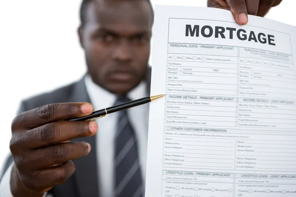 Businessman showing mortgage document — Stock Photo, Image
