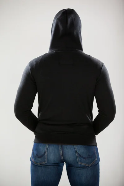 Achteraanzicht van de spion in een hoodie — Stockfoto