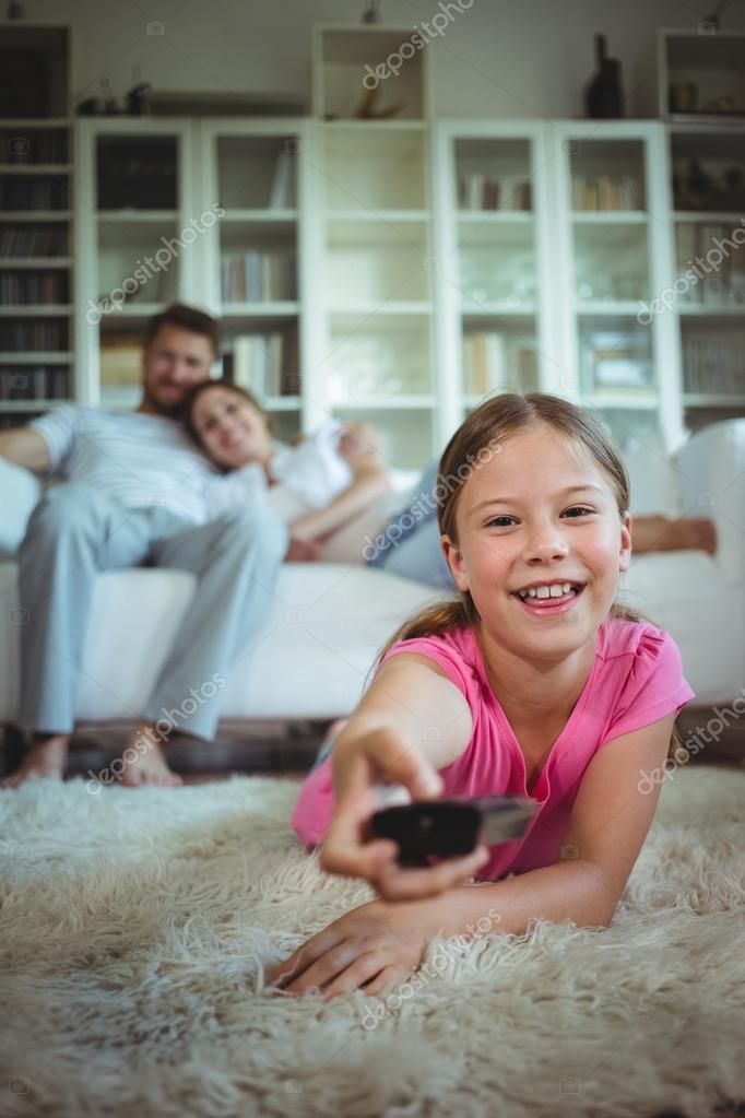 Girl Lying On Rug And Changing Channels Stock Photo Wavebreaka 126934952 - Who Is The New Rug And Home Girl Girl Lying On Rug And Changing Channels Stock Photo Wavebreaka 126934952 - Who Is The New Rug And Home Girl
