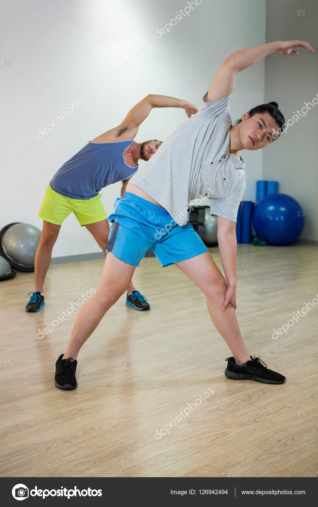 Two men doing aerobic exercise Stock Photo by Wavebreakmedia