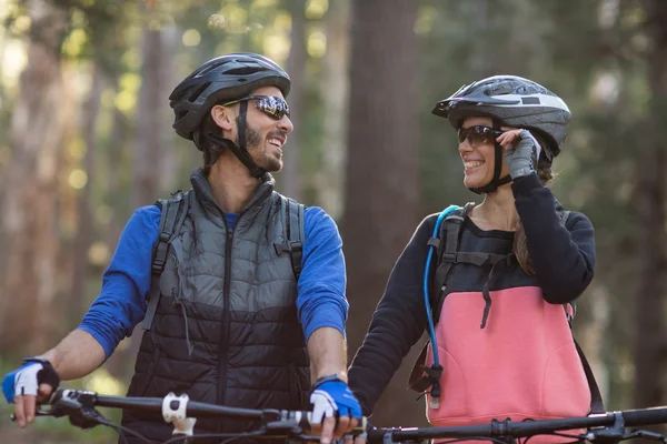 Biker couple smiling and looking at each other — Stock Photo, Image