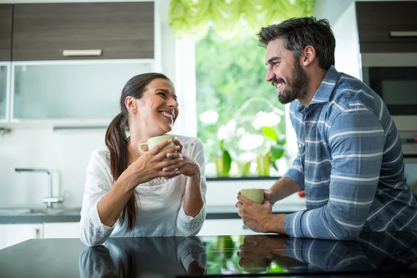 Couple interacting while having coffee — Stock Photo, Image