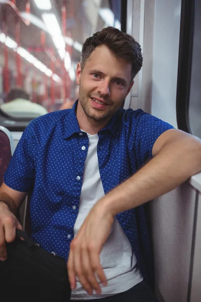 Handsome man traveling in train — Stock fotografie