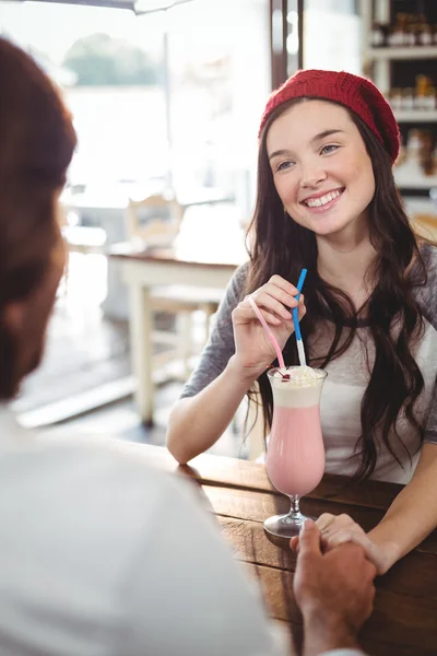 Couple drinking milkshake with straws — Stock Photo, Image