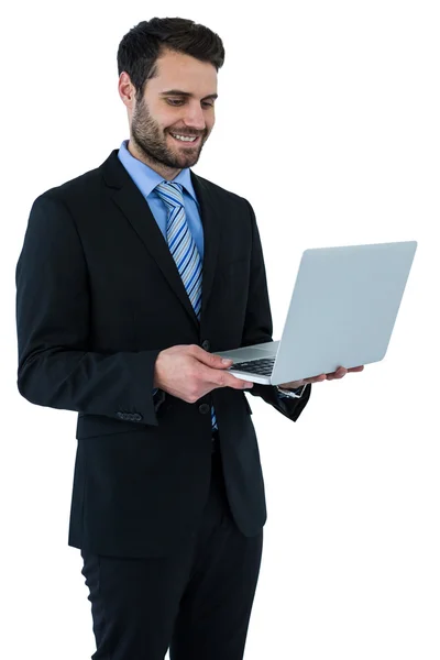 Affärsman anläggning laptop — Stockfoto