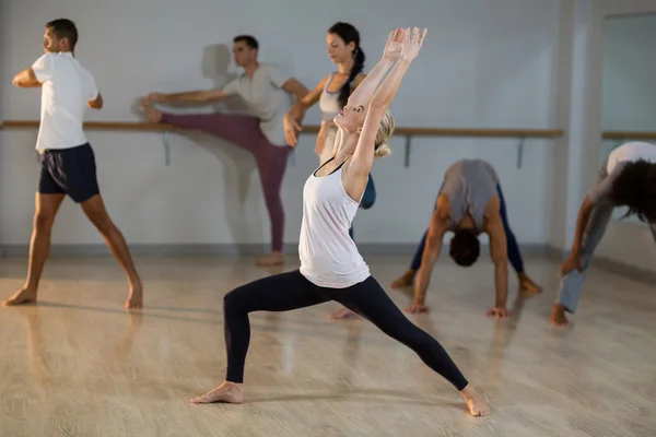 Woman performing stretching exercise — Stock Photo, Image