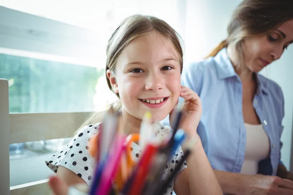 Daughter sitting next to mother — Stock fotografie