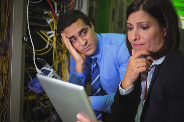 Bored technician looking at colleague — Stock Photo, Image