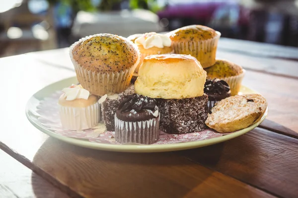 Desserts on plate in cafeteria — Stock Photo, Image