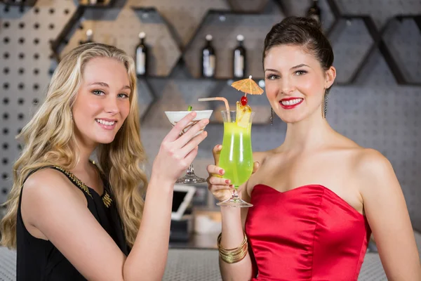 Female friends holding glass of cocktail — Stock Photo, Image