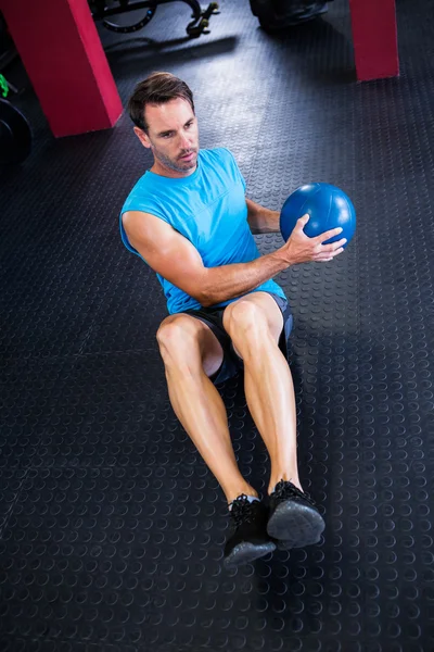 Athlete holding ball — Stock Photo, Image