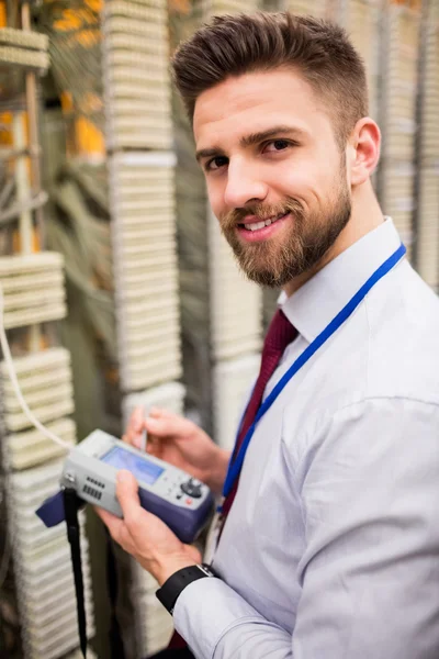 Technician using digital cable analyzer — Stock Photo, Image