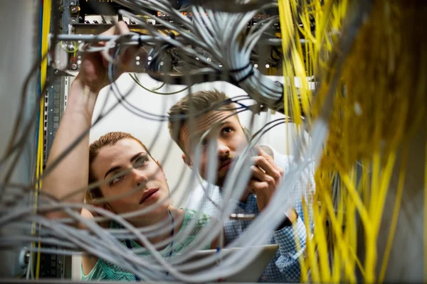 Technicians fixing cable — ストック写真