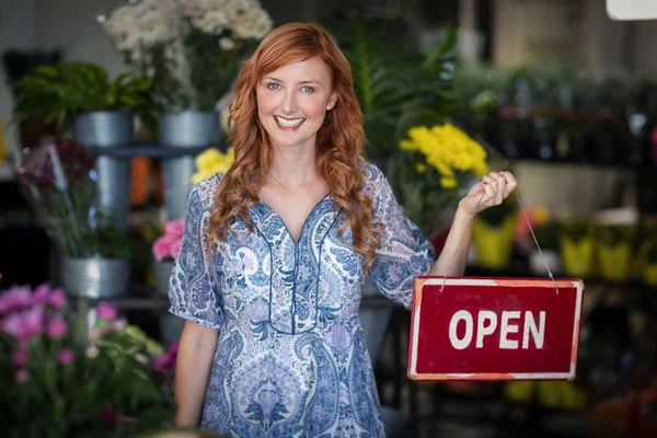 Florists holding open sign placard — Stock fotografie