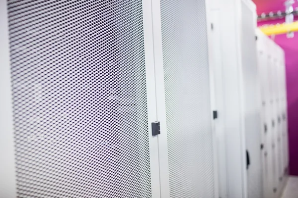 Hallway with row of servers — ストック写真