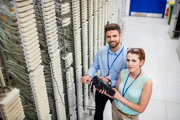 Technicians using digital cable analyzer — Stock Photo, Image