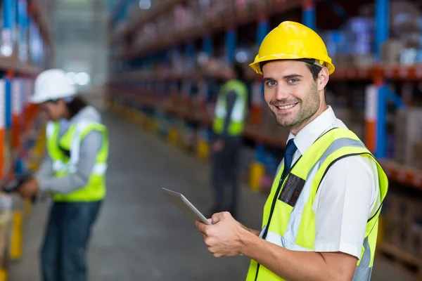 Warehouse manager holding digital tablet — Stock Photo, Image