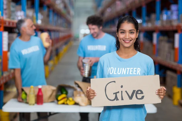 Volunteer holding sign board with message — Stock Photo, Image