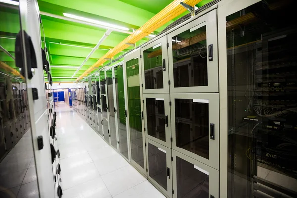 Hallway with row of servers — Stock Photo, Image