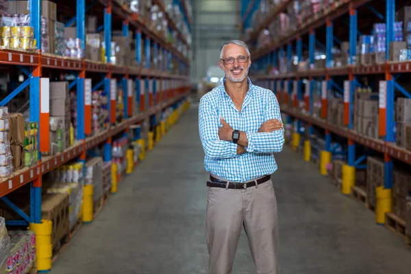 Warehouse manager standing with arms crossed — Stock Photo, Image