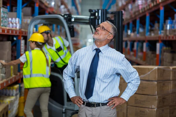 Warehouse manager standing with hands on hips — Stock Photo, Image